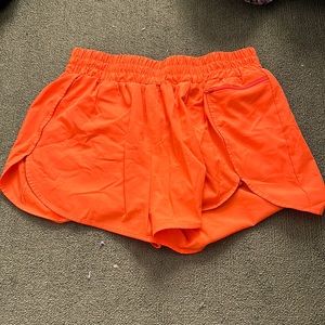 Neon orange athletic shorts